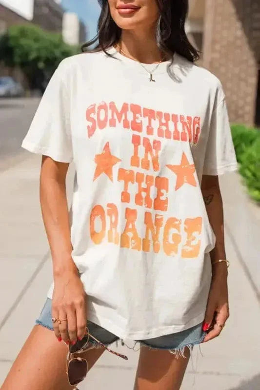 SOMETHING IN THE ORANGE Graphic T-Shirt-0